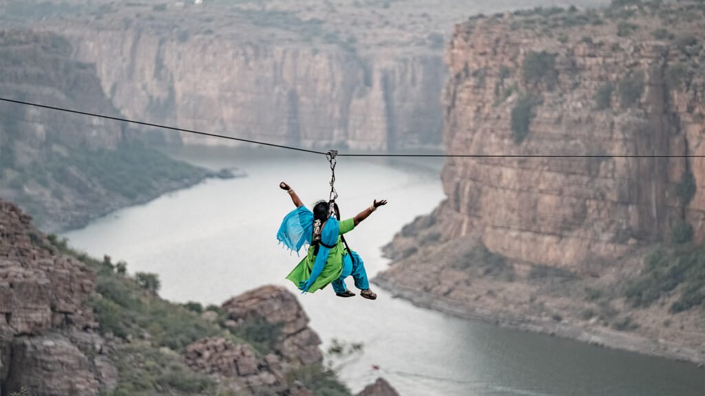 Tourist woman ziplining at Gandikota, the Grand Canyon of India, with Adventure Sports Academy of Andhra Pradesh (ASAAP)