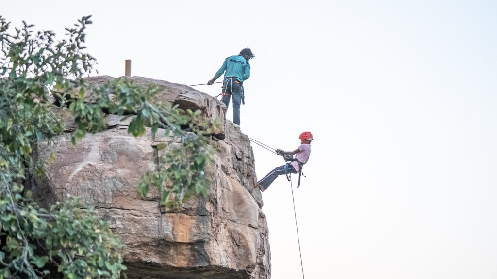 Tourist rappelling at Gandikota during sunset with Adventure Sports Academy of Andhra Pradesh (ASAAP)